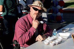 courtesy photo/rialto network Rialto police Captain Andy Karol ponders on which chili to vote for during last year’s Chili Cook Off.  