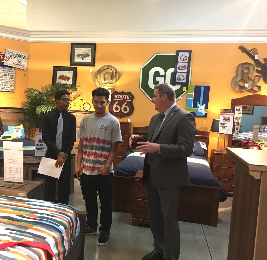 Foster youth receive donations from Ashley Furniture