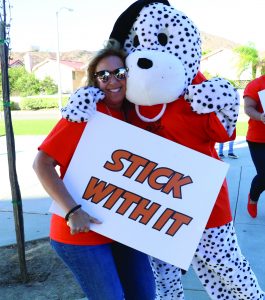 Photo/Anthony Victoria: Michael D’arcy Elementary School first grade teacher Connie Brown with school mascot Dalmatian.
