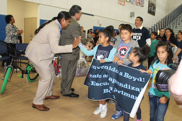 courtesy photo/ rialto unified school district RUSD Board member Edgar Montes high fives and cheers students on during the opening rally at the 8th annual Parent Summit at Carter High School Oct. 15.