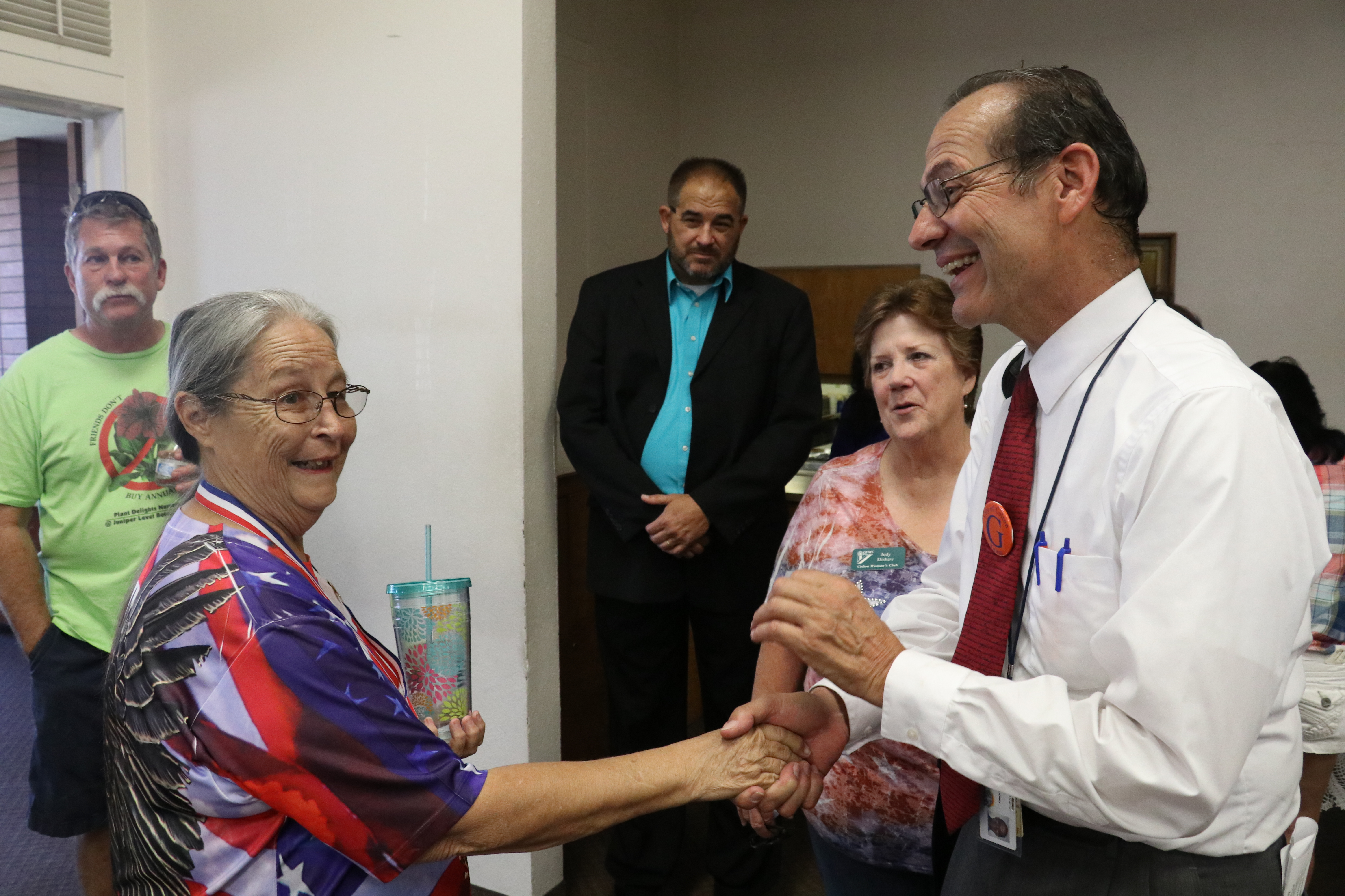 Photo/Anthony Victoria: Councilman Dr. Luis Gonzalez, right, thanking Vietnam War veteran Sandy Rexach-Young for her service. 