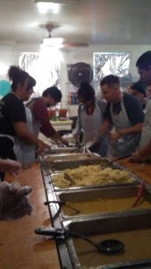 Photo/MJ Duncan Nearly 500 volunteers bustled from the kitchen to the courtyard and main dining hall to dish and serve plates brimming with turkey, mashed potatoes, green bean casserole, corn and stuffing to the area’s underserved population.