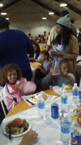 Photo/MJ Duncan A few of the younger ones enjoying the pre-Thanksgiving dinner, Zayla, 9, and Malachi, 13.