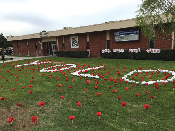 iecn photo/ yazmin alvarez Frisbie Middle School placed red and white paper flowers along the school’s front lawn as part of Red Ribbon Week.
