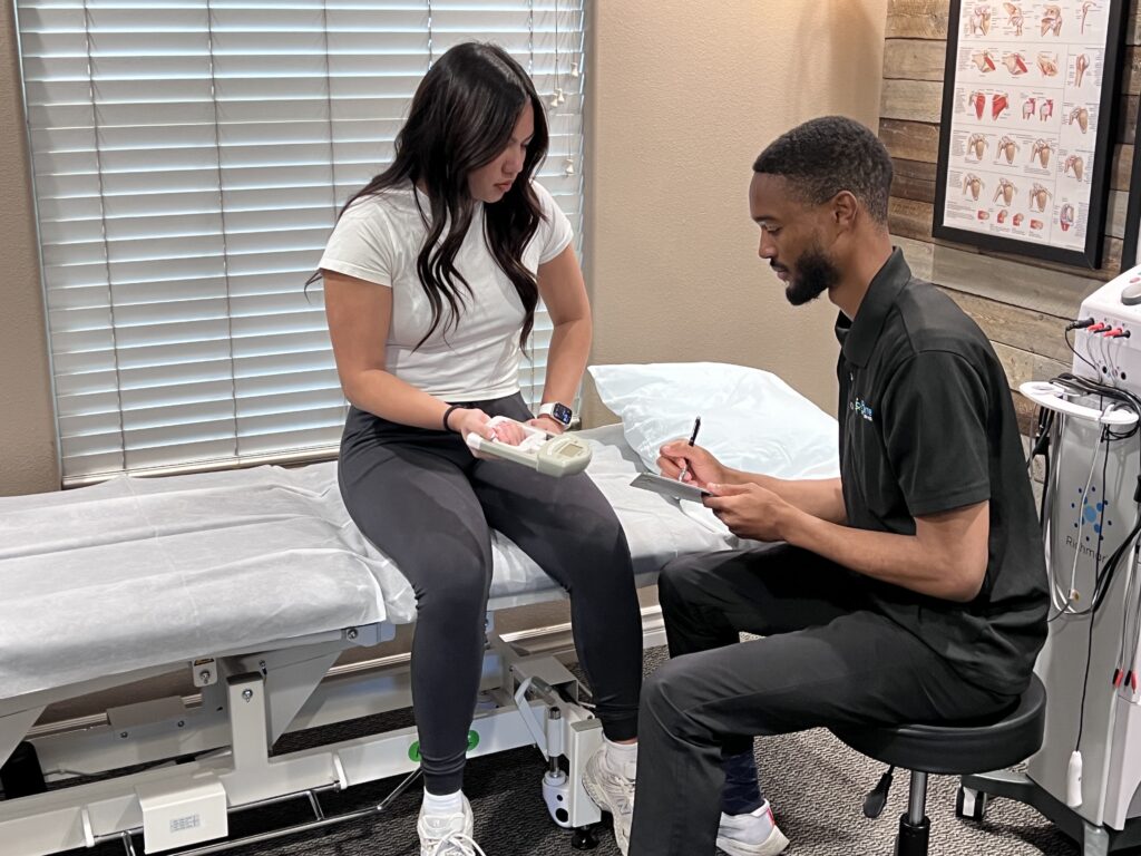 A physical therapist and patient