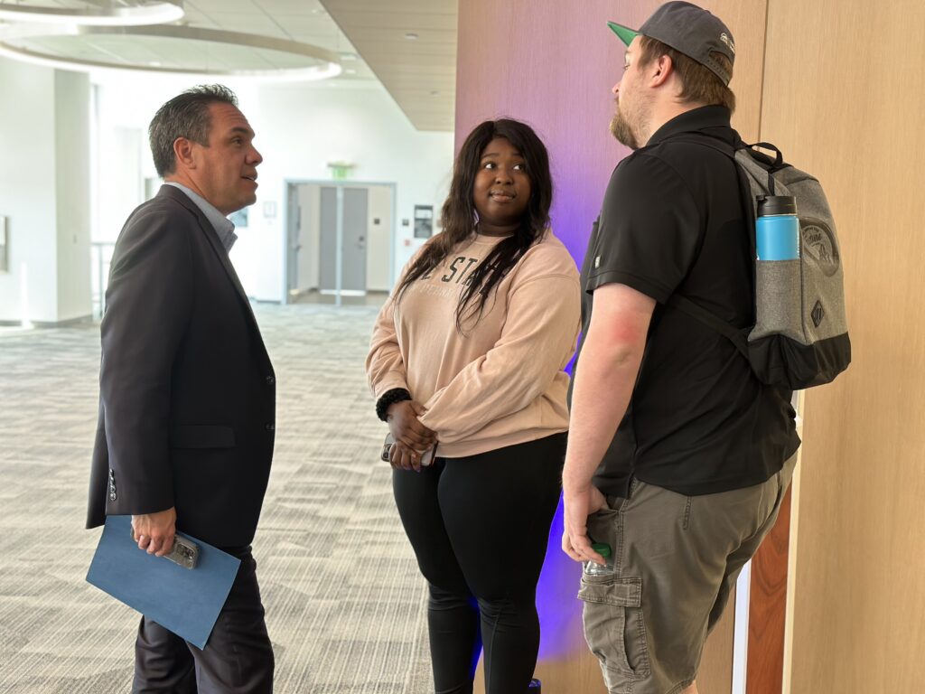 A regional politician speaking with students