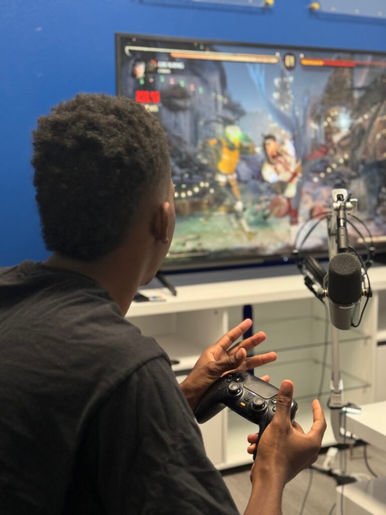 A student gamer playing a video game